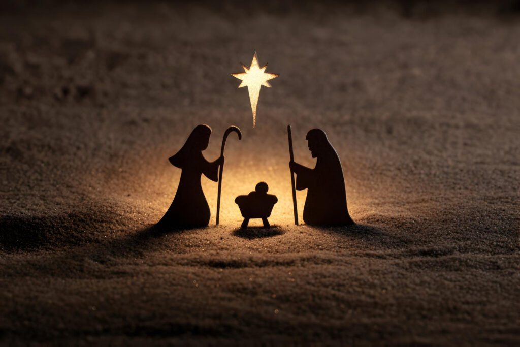 Siluetas de María, José y el Niño Jesús en un belén iluminado por una estrella.